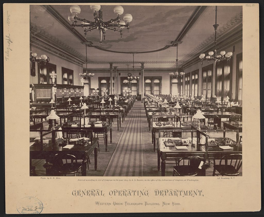 Rows of telegraph operators at desks in Western Union's general operating department